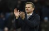 Leeds United's head coach Jesse Marsch applauds his teams travelling fans after the end of the English Premier League soccer match between Aston Villa and Leeds United at Villa Park in Birmingham, England, Friday, Jan. 13, 2023. Villa won the game 2-1. (AP Photo/Rui Vieira)