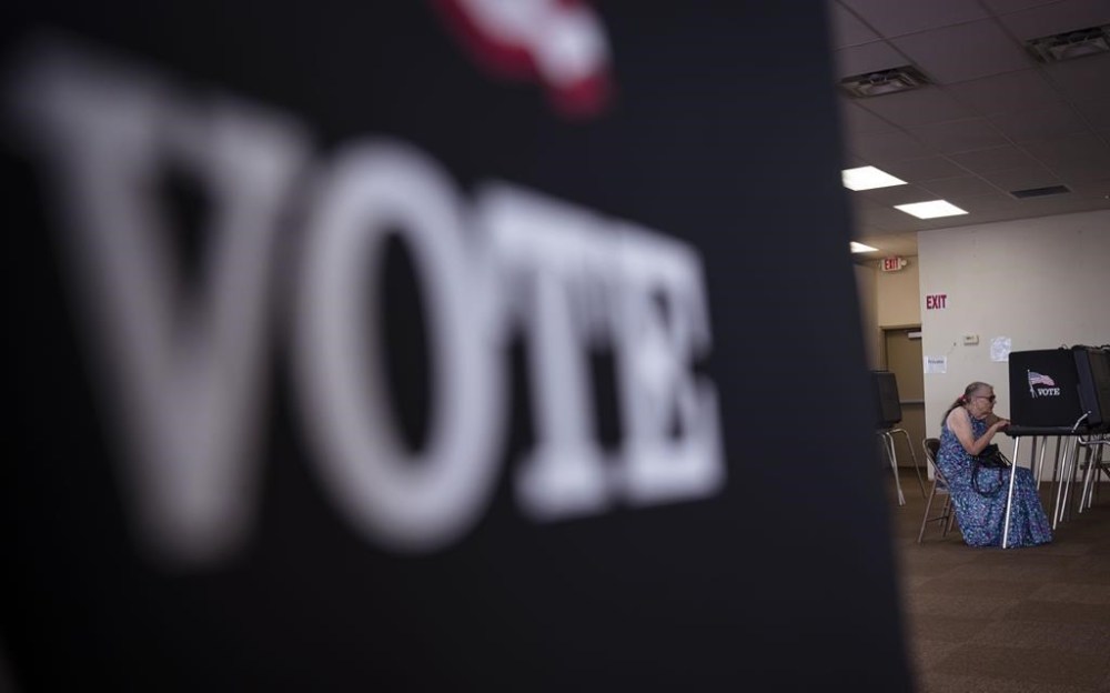 Cecelia Ammon fills out her ballot on primary election day at the Central Mercado in Southeast Albuquerque, N.M., on Tuesday, June 4, 2024. (Chancey Bush/The Albuquerque Journal via AP)
