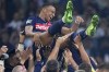 PSG's Kylian Mbappe is tossed into the air as he celebrates with teammates after the French Cup final soccer match between Lyon and PSG at the Pierre Mauroy stadium in Villeneuve d'Ascq, northern France, Saturday, May 25, 2024. PSG won the match 2-1. (AP Photo/Michel Euler)