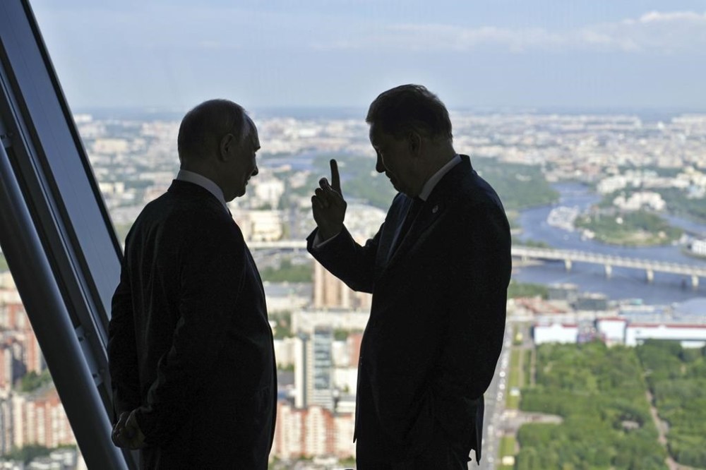 Russian gas monopoly Gazprom head Alexei Miller, right, gestures as he speaks to Russian President Vladimir Putin during their visit to the Lakhta Center skyscraper, the headquarters of Russian gas monopoly Gazprom in St. Petersburg, Russia, Wednesday, June 5, 2024. (Alexander Zholobov, Sputnik, Kremlin Pool Photo via AP)