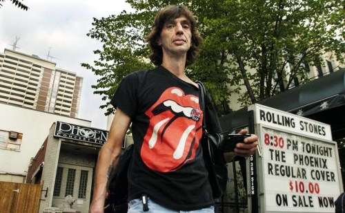 Andre Blais leaves the Phoenix Concert Theatre with his ticket for the Rolling Stones show in Toronto on Wednesday August 10, 2005. (THE CANADIAN PRESS/Aaron Harris)