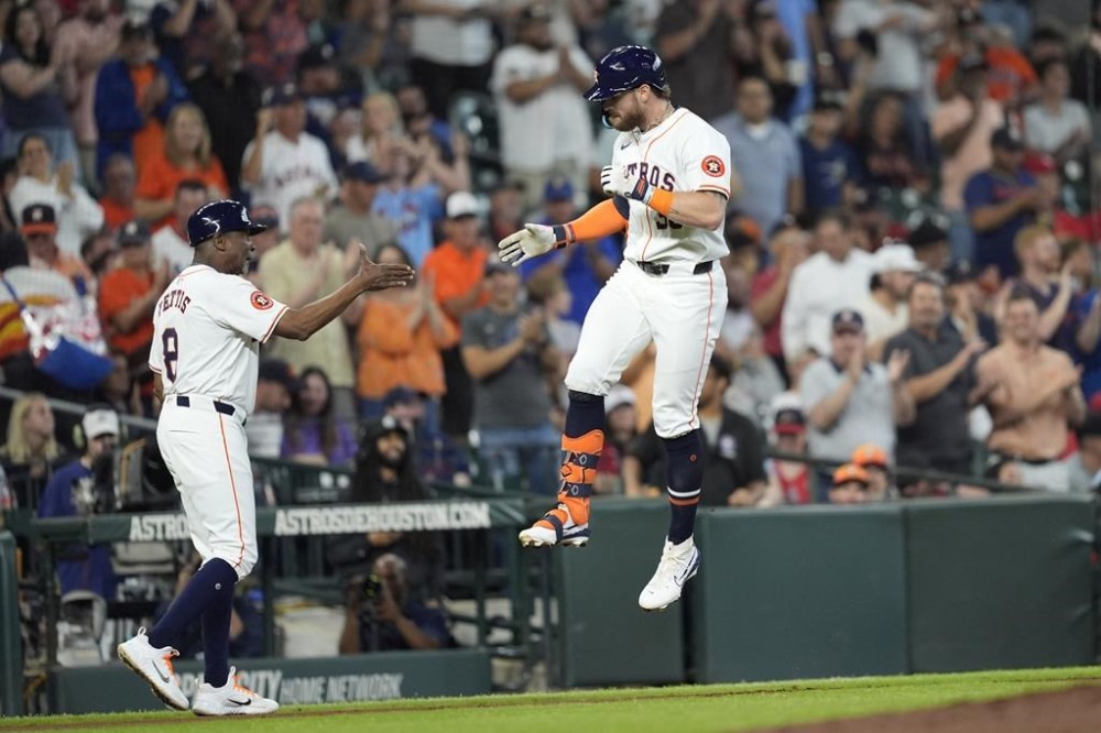 Houston Astros' Trey Cabbage, right, celebrates with third base coach Gary Pettis (8) after hitting a home run against the St. Louis Cardinals during the fifth inning of a baseball game Wednesday, June 5, 2024, in Houston. (AP Photo/David J. Phillip)