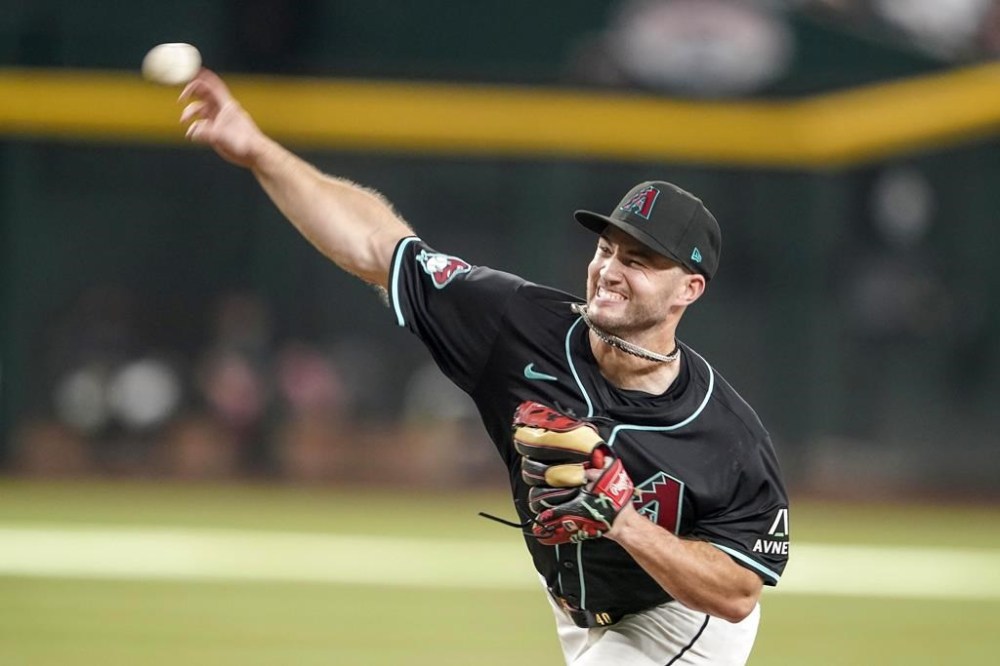 Arizona Diamondbacks pitcher Bryce Jarvis throws against the San Francisco Giants during the third inning of a baseball game Wednesday, June 5, 2024, in Phoenix. (AP Photo/Darryl Webb)