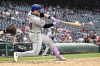 New York Mets' Harrison Bader hits a double that scored two runs during the sixth inning of a baseball game against the Washington Nationals, Wednesday, June 5, 2024, in Washington. (AP Photo/Nick Wass)
