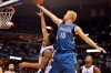 FILE - Minnesota Timberwolves forward Chase Budinger (10) shoots over Memphis Grizzlies guard Courtney Lee during the second half of an NBA basketball game Oct. 29, 2014, in Memphis, Tenn. Former NBA player Budinger is going to the Olympics — for beach volleyball. The 6-foot-7 Californian, who helped Arizona reach the Sweet 16 in 2009 before playing seven seasons with the Rockets, Timberwolves, Pacers and Suns, earned a berth with Miles Evans as the No. 2 U.S. men’s pair at the FIVB tournament Wednesday, June 5, 2024, in Ostrava, Czechia. (AP Photo/Brandon Dill, File)