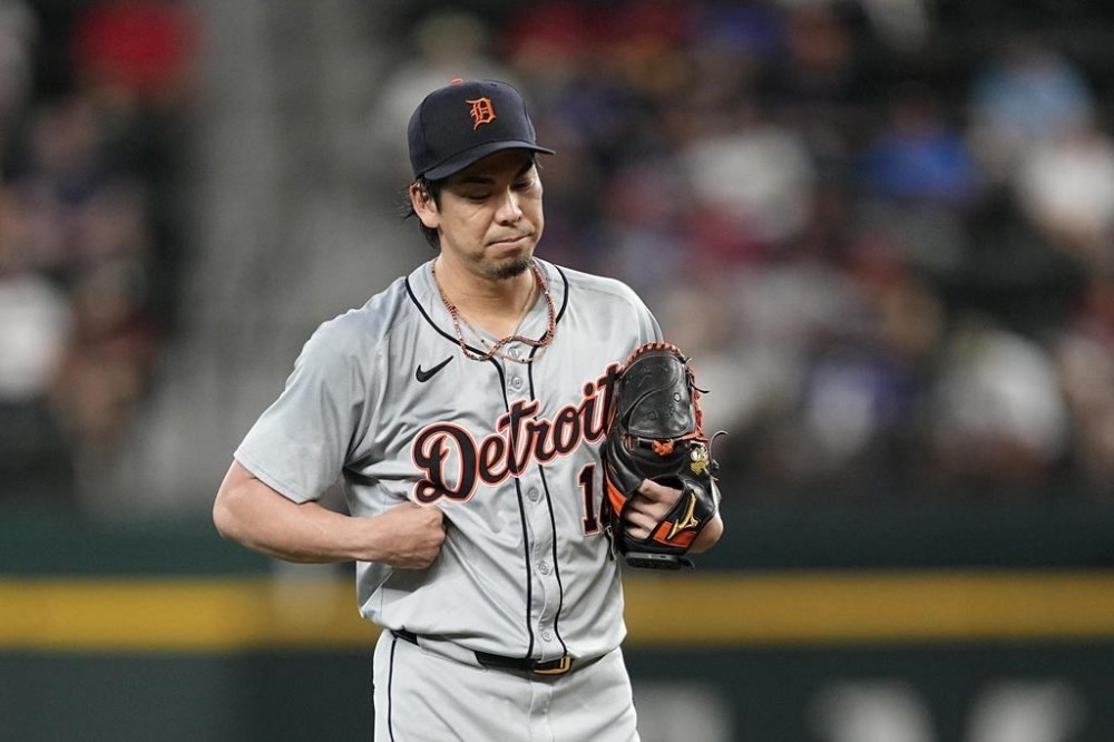 Detroit Tigers' Kenta Maeda holds the side of his chest during the first inning of the team's baseball game against the Texas Rangers, Wednesday, June 5, 2024, in Arlington, Texas. (AP Photo/Tony Gutierrez)