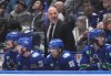 Vancouver Canucks head coach Rick Tocchet stands on the bench during the first period of an NHL hockey game against the Pittsburgh Penguins, in Vancouver, on Tuesday, February 27, 2024. Watching hockey hasn't been easy for Vancouver Canucks head coach Rick Tocchet recently. THE CANADIAN PRESS/Darryl Dyck