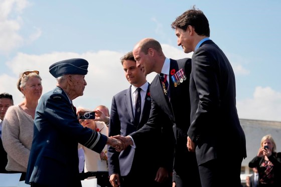 Prince William, the Prince of Wales greets 100-year-old Canadian veteran Richard Rohmer, accompanied by the Prime Minister of France Gabriel Attal and Prime Minister Justin Trudeau, at a ceremony to mark the 80th anniversary of D-Day, at Juno Beach in Courseulles-sur-Mer, Normandy, France, Thursday. (Adrian Wyld / The Canadian Press)