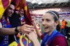 Barcelona's Aitana Bonmati celebrates with fans after winning the women's Champions League final soccer match between FC Barcelona and Olympique Lyonnais at the San Mames stadium in Bilbao, Spain, Saturday, May 25, 2024. Barcelona won 2-0. (AP Photo/Jose Breton)