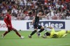 Hwang Hee Chan of South Korea tries to dribble past Hassan Sunny of Singapore during 2026 FIFA World Cup Asian 2nd Qualifier soccer match between Singapore and South Korea at the National Stadium on Thursday June 6, 2024 in Singapore. (AP Photo/Suhaimi Abdullah)