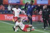 Netherlands' Ryan Gravenberch, top right, and Canada's Jonathan David, left, and Canada's Alistair Johnston, sliding, vie for the ball during the international friendly soccer match between The Netherlands and Canada at De Kuip stadium in Rotterdam, Netherlands, Thursday, June 6, 2024. THE CANADIAN PRESS/AP-Patrick Post