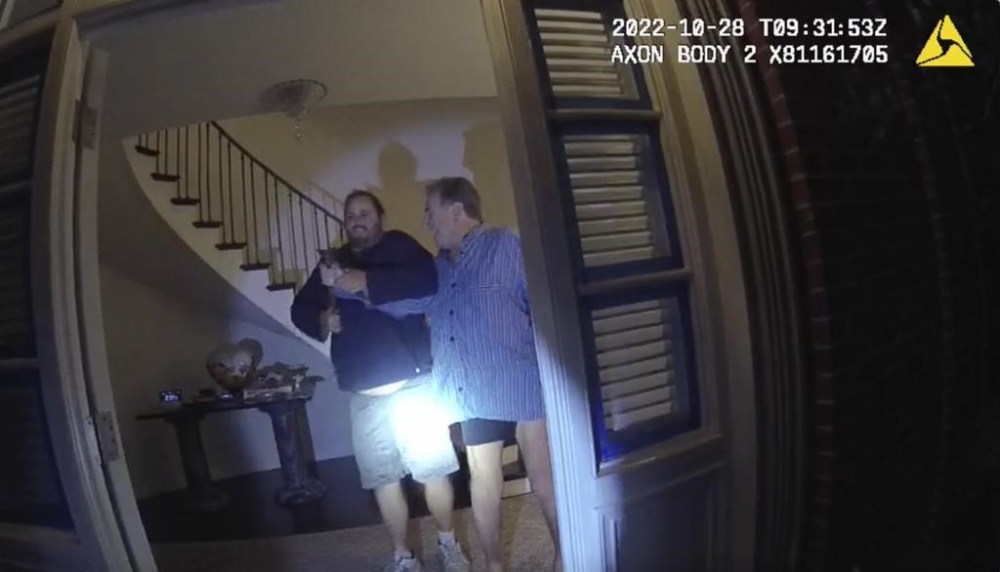 FILE - In this image taken from San Francisco Police Department body-camera video, the husband of former U.S. House Speaker Nancy Pelosi, Paul Pelosi, right, fights for control of a hammer with his assailant David DePape during a brutal attack in the couple's San Francisco home, Oct. 28, 2022. A judge has dismissed several criminal charges against Paul Pelosi's attacker, DePape, in state court. The judge ruled on Thursday, June 6, 2024, following the defense’s argument of double jeopardy. (San Francisco Police Department via AP, File)