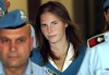 FILE - Amanda Knox, center, is escorted by Italian penitentiary police officers to Perugia's court, in Italy, Sept 26, 2008. Knox was a 20-year-old exchange student in the university town of Perugia when she and her then-Italian boyfriend were accused of murdering her housemate, and then exonerated in 2015. Knox told Italian TV on Thursday, June 6, 2024, that she was surprised by a Florence appeals court's decision to find her guilty of slander, and vowed to 'fight for the truth'. (AP Photo/Pier Paolo Cito, File)