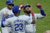 Los Angeles Dodgers' Teoscar Hernández, right, celebrates with Jason Heyward (23) as he returns to the dugout after hitting a solo home run off Pittsburgh Pirates starting pitcher Bailey Falter during the fifth inning of a baseball game in Pittsburgh, Thursday, June 6, 2024. (AP Photo/Gene J. Puskar)