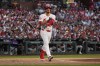 St. Louis Cardinals' Nolan Arenado tosses his bat after earning a walk during the second inning of a baseball game against the Colorado Rockies Thursday, June 6, 2024, in St. Louis. (AP Photo/Jeff Roberson)