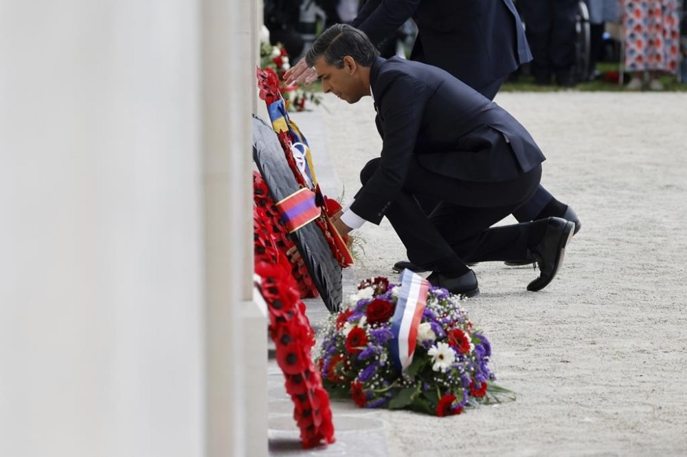 Britain's Prime Minister Rishi Sunak lays a wreath during a commemorative ceremony marking the 80th anniversary of the World War II D-Day
