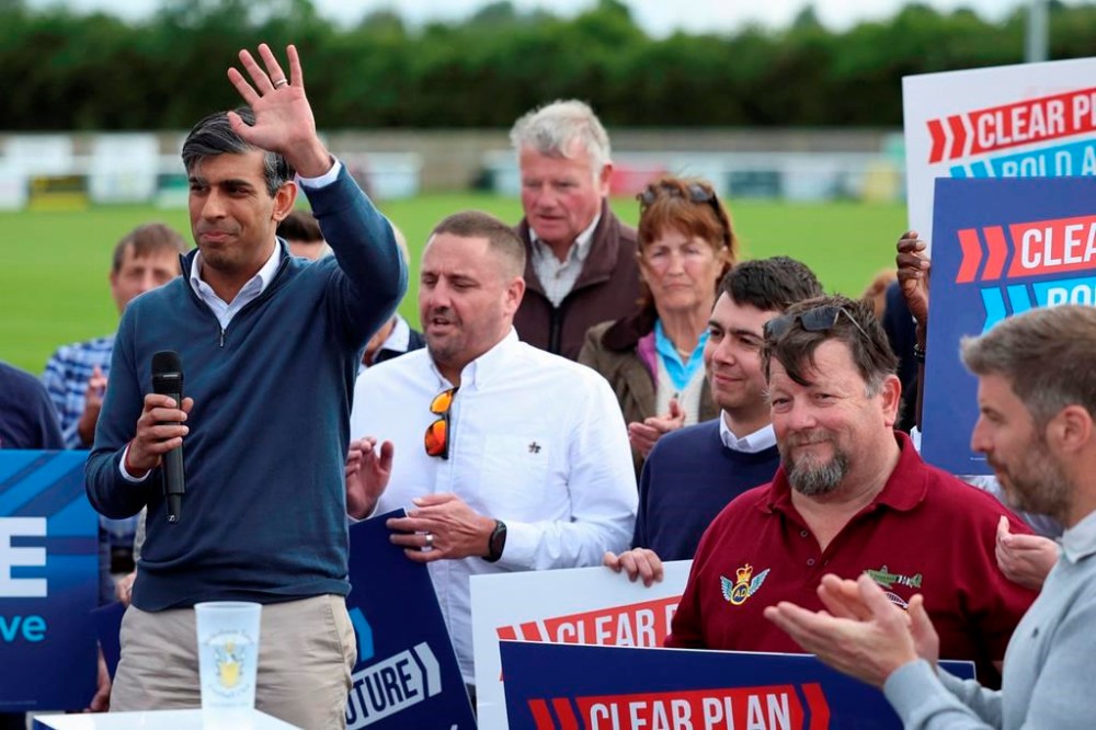 British Prime Minister Rishi Sunak visits the Melksham Town F.C. for a Conservative general election campaign event in Melksham, England, Friday June 7, 2024. (Phil Noble, Pool Photo via AP)