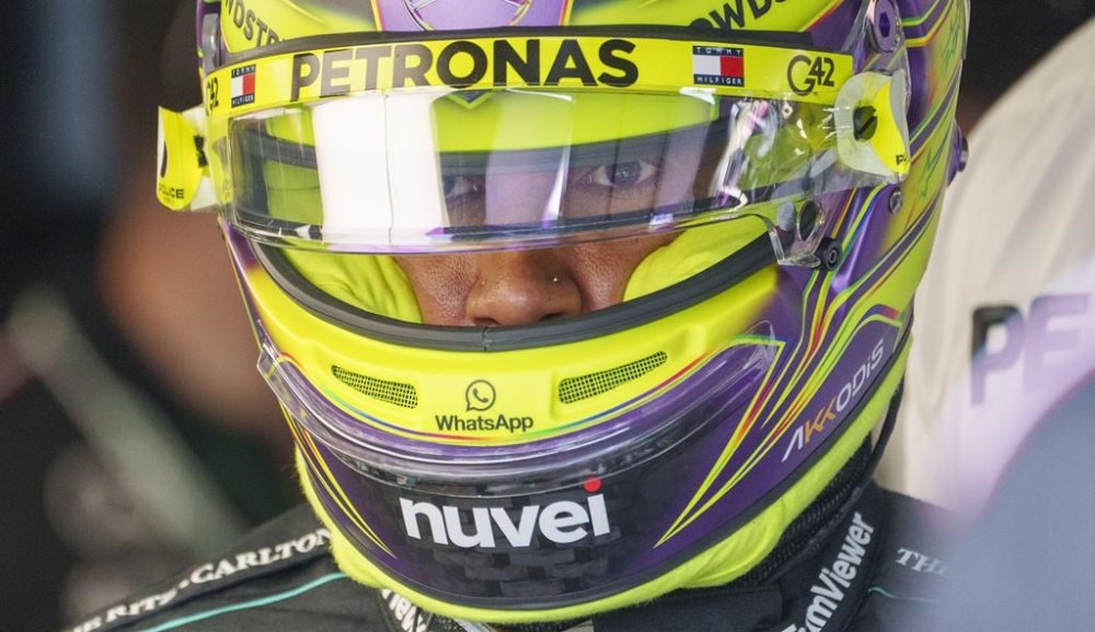 Mercedes driver Lewis Hamilton of Great Britain heads to his car for the first practice session at the Canadian Grand Prix on Friday, June 7, 2024 in Montreal. Hamilton is intrigued by the idea of a transfer window or free agency in Formula One, but the seven-time world champion believes F1’s wild west of a driver market generates more than enough excitement THE CANADIAN PRESS/Paul Chiasson