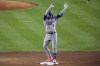 Los Angeles Dodgers' Kiké Hernández (8) gestures to fans after hitting a double during the seventh inning of a baseball game against the New York Yankees, Friday, June 7, 2024, in New York. (AP Photo/Frank Franklin II)