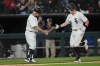 Chicago White Sox's Andrew Vaughn, right, slaps hands with third base coach Eddie Rodriguez after hitting a home run against the Boston Red Sox during the sixth inning of a baseball game Friday, June 7, 2024, in Chicago. (AP Photo/Erin Hooley)