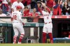 Los Angeles Angels' Kevin Pillar, left, is given an electronic halo by Zach Neto after hitting a solo home run during the second inning of a baseball game against the Houston Astros, Friday, June 7, 2024, in Anaheim, Calif. (AP Photo/Ryan Sun)