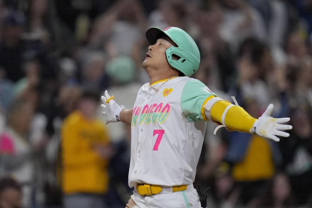 San Diego Padres' Ha-Seong Kim celebrates after hitting a two-run home run during the sixth inning of a baseball game against the Arizona Diamondbacks, Friday, June 7, 2024, in San Diego. (AP Photo/Gregory Bull)
