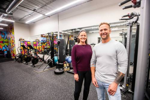 photos by MIKAELA MACKENZIE / FREE PRESS
                                Thor Plumbing and Heating company president Justin Thor (right) and office manager Christina Thor in the business&rsquo;s gym space.