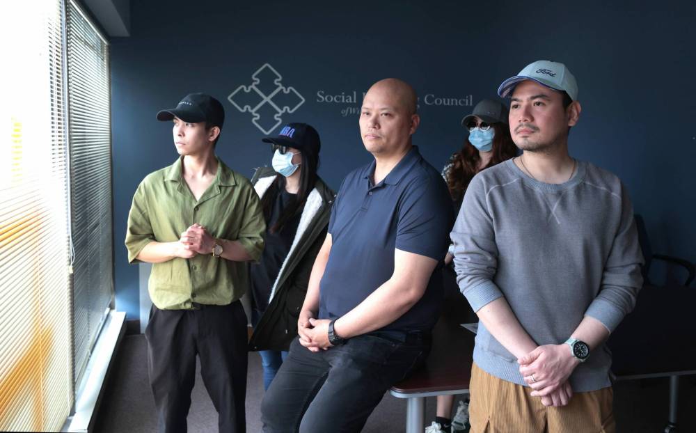 RUTH BONNEVILLE / FREE PRESS
John Maravilla (from left, front row), Diwa Marcelino and Jmillson Santos and others shared their story Monday at a news conference calling for change to Canada’s Temporary Foreign Worker program.