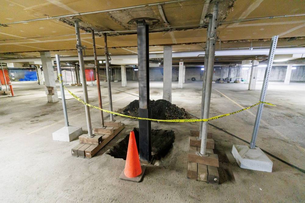 Support pillars are being reinforced in the parking garage of Birchwood Terrace at 2440 Portage Ave. (Mike Deal / Free Press)