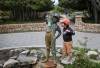 Ruth Bonneville / Free Press
                                Jackson Grusko, age three, gets a closer look at the Boy with the Boot statue at the entrance to the Assiniboine Park’s English Garden Monday. The statue is one of several structures that are being considered for heritage status.