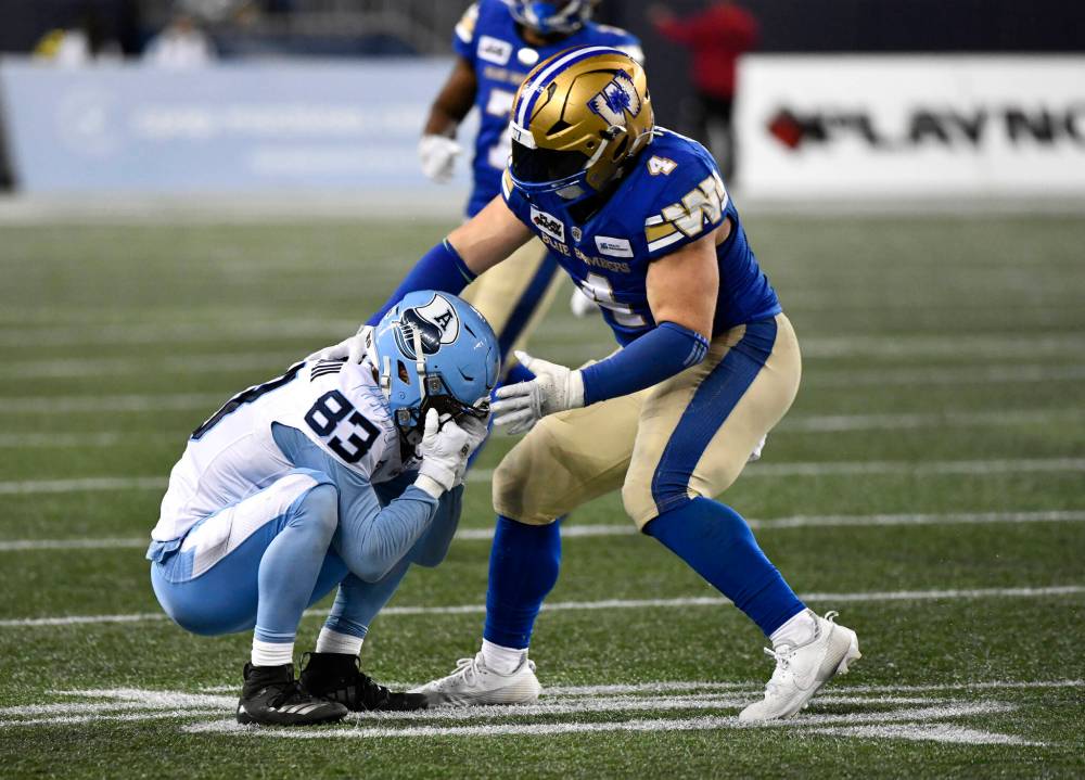 FRED GREENSLADE / THE CANADIAN PRESS FILES
With Bighill (right) sidelined with an injury, the competition is tough to fill his spot on the Blue Bombers defence.
