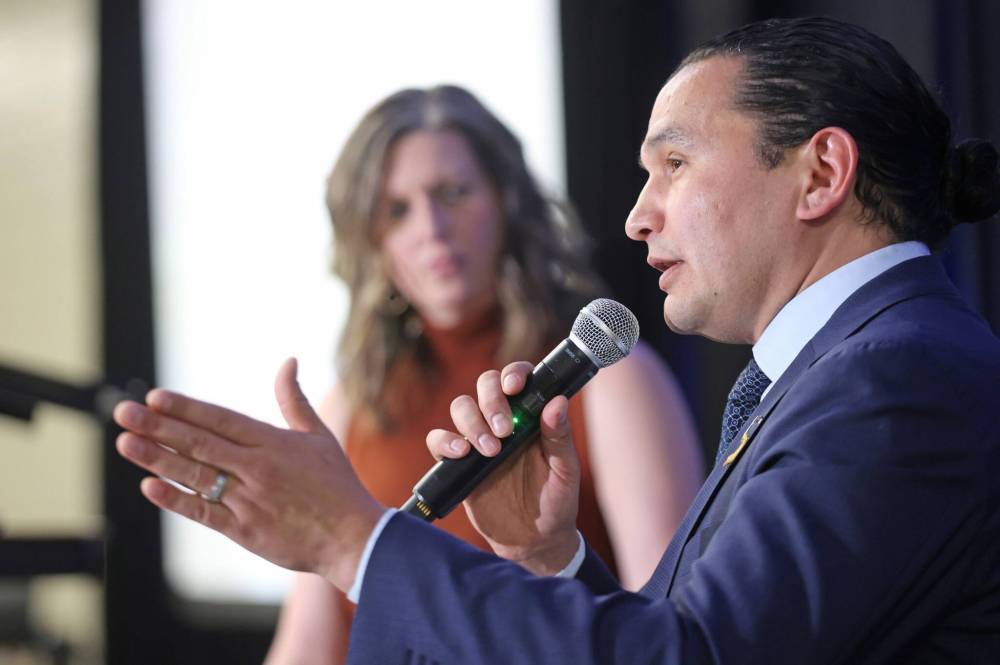 Matt Goerzen/The Brandon Sun
Brandon Chamber of Commerce president Lois Ruston looks on as Manitoba Premier Wab Kinew speaksduring a question and answer session following his State of the Province speech in Brandon, Thursday.