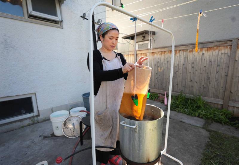 Ruth Bonneville / Free Press
Tsuboi dyes and hangs fabric on the line outside her home.