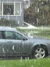 Hail falls on a car in Silver Heights on May 16. (Alexander Pankiw photo)