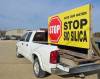 JORDAN ROSS / THE CARILLON FILES
                                A pickup truck carries a large sign opposing Sio Silica’s plans to mine and process silica sand in Vivian.