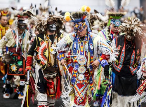 JOHN WOODS / FREE PRESS Dancers perform during the grand entrance at Manito Abhee powwow Sunday, May 19, 2024.
