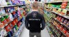 MIKE DEAL / FREE PRESS ILLUSTRATION 
An Impact Security guard walks down a grocery isle.
240531 - Friday, May 31, 2024.