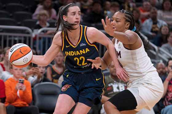 Indiana Fever's Caitlin Clark (left) looks to pass the ball as Atlanta Dream's Naz Hillmon defends during the second half of a WNBA preseason basketball game Thursday in Indianapolis. (AP Photo/Darron Cummings)