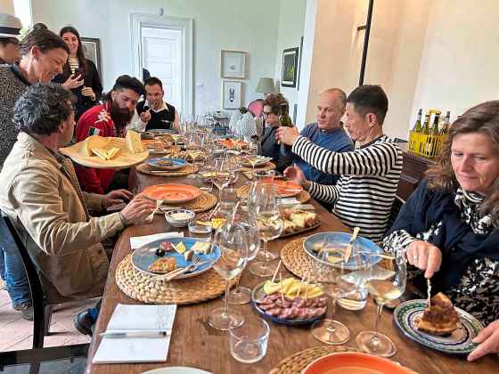 Our little group of wine writers from all corners of the globe enjoy lunch at Graci, a winery north of Etna whose wines are stellar. Note the giant hunks of local cheese being offered around. (Ben Sigurdson / Free Press files)