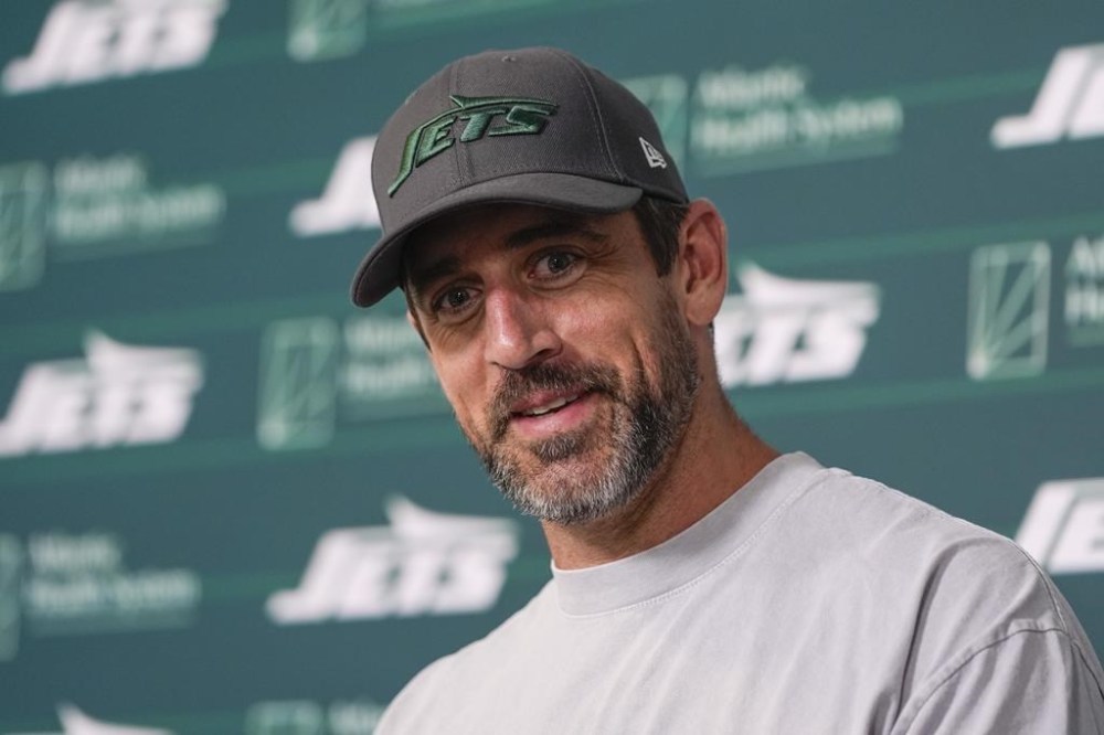 New York Jets quarterback Aaron Rodgers talks to reporters after a practice at the NFL football team's training facility in Florham Park, N.J., Tuesday, May 21, 2024. (AP Photo/Seth Wenig)