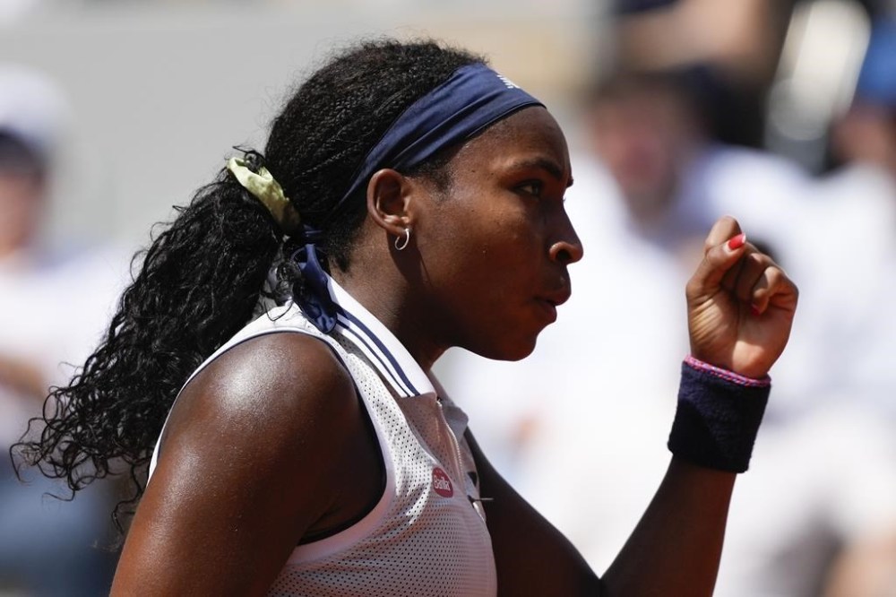 Coco Gauff of the U.S. clenches her fist after scoring a point against Tunisia's Ons Jabeur during their quarterfinal match of the French Open tennis tournament at the Roland Garros stadium in Paris, Tuesday, June 4, 2024. (AP Photo/Thibault Camus)