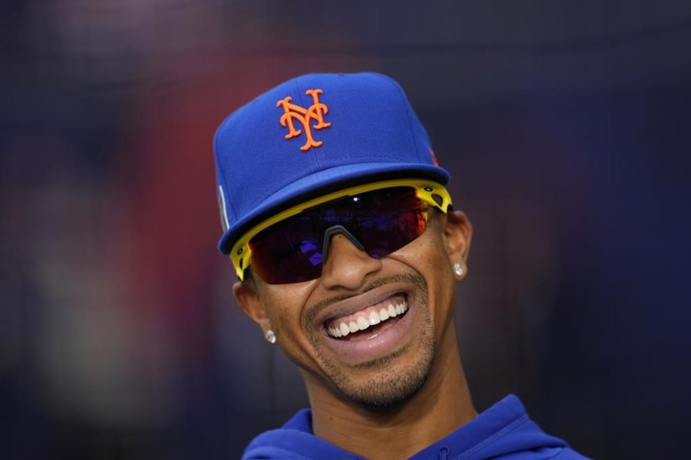 New York Mets Francisco Lindor smiles during a workout day at the London stadium in London, Friday, June 7, 2024. New York Mets will play games against Philadelphia Phillies at the stadium on June 8 and June 9. (AP Photo/Kirsty Wigglesworth)