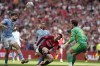 Manchester City's Josko Gvardiol, left, heads the ball to his goalkeeper Manchester City's goalkeeper Stefan Ortega, right, before Manchester United's Alejandro Garnacho, center, scores his side's opening goal during the English FA Cup final soccer match between Manchester City and Manchester United at Wembley Stadium in London, Saturday, May 25, 2024. (AP Photo/Kin Cheung)