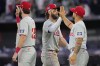 Philadelphia Phillies' Bryce Harper, center, celebrates with teammates after defeating the New York Mets in a London Series baseball game in London, Saturday, June 8, 2024. (AP Photo/Kirsty Wigglesworth)