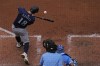 Seattle Mariners' Mitch Garver hits a solo home run during the fifth inning of a baseball game against the Kansas City Royals Saturday, June 8, 2024, in Kansas City, Mo. (AP Photo/Charlie Riedel)