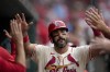St. Louis Cardinals' Matt Carpenter is congratulated by teammates after hitting a solo home run during the seventh inning of a baseball game against the Colorado Rockies Saturday, June 8, 2024, in St. Louis. (AP Photo/Jeff Roberson)