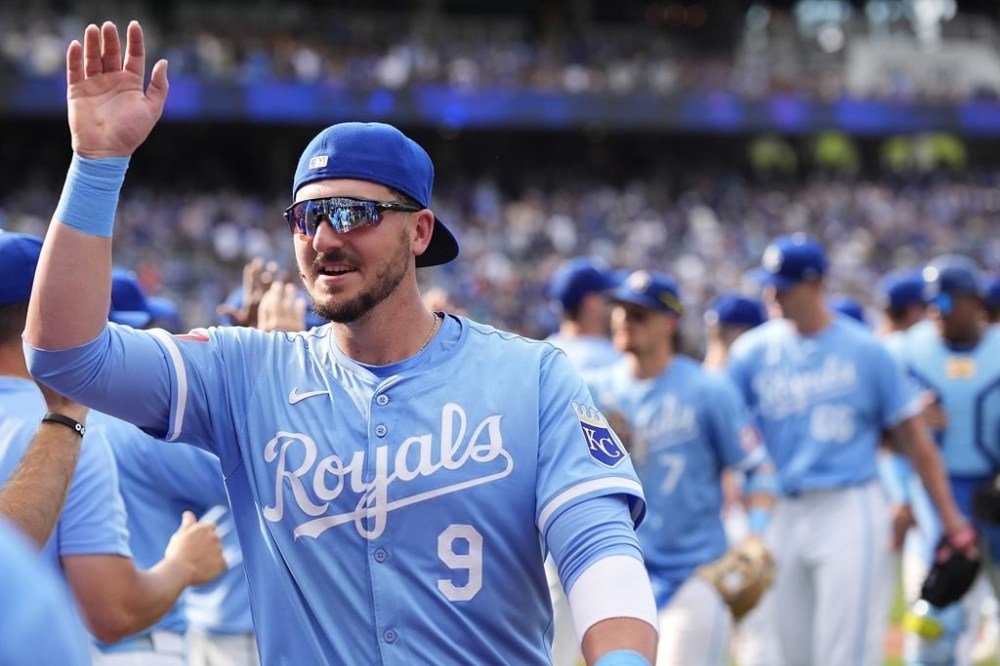 Kansas City Royals' Vinnie Pasquantino celebrates with teammates after their baseball game against the Seattle Mariners Saturday, June 8, 2024, in Kansas City, Mo. The Royals won 8-4. (AP Photo/Charlie Riedel)