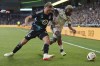 Minnesota United defender Victor Eriksson, left, and FC Dallas forward Bernard Kamungo vie for possession of the ball during the second half of an MLS soccer match in St. Paul, Minn., Saturday, June 8, 2024. (AP Photo/Abbie Parr)