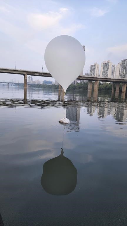 This photo provided by South Korea's Joint Chiefs of Staff and released by South Korea Defense Ministry, shows a balloon presumably sent by North Korea, on the Han River in Seoul, South Korea, Sunday, June 9, 2024. North Korea flew hundreds of trash-carrying balloons to South Korea again in its third such campaign since late May, the South’s military said, just days after South Korean activists floated their own balloons to scatter propaganda leaflets in the North. (South Korea Joint Chiefs of Staff via AP)