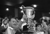 FILE -Liverpool captain Alan Hansen, right, and Liverpool goalkeeper Bruce Grobbelaar hold the trophy of the Villa de Madrid after their victory 1-0 over the Atletico de Madrid on Sunday, August 23, 1987. Liverpool says its former captain Alan Hansen is seriously ill in hospital. The Premier League club is providing support to the family of the 68-year-old former Scotland international, who retired in 1991 to start a successful career as a television pundit. (AP Photo/Toka, File)